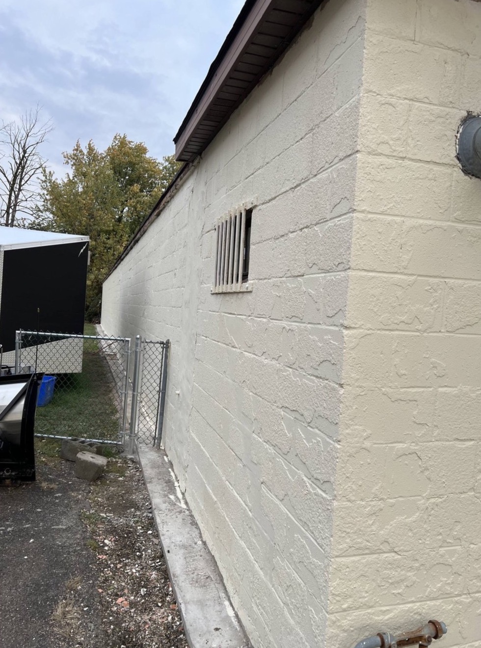 Side wall and rear yard at 2918 Lockport Road
